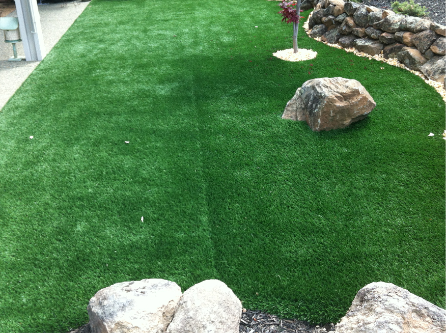 Artificial turf grass lawn seam needing repairs